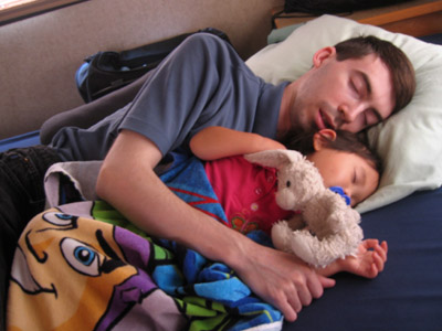 Daddy and baby in the middle of a nap together (the 'Buz Lightyear blanket' (towel) was a VERY valued item throughout the trip)